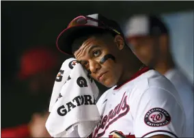  ?? AP PHOTO/NICK WASS ?? Washington Nationals’ Juan Soto wipes his face in the dugout before a baseball game against the Atlanta Braves, Sunday, July 17, 2022, in Washington.