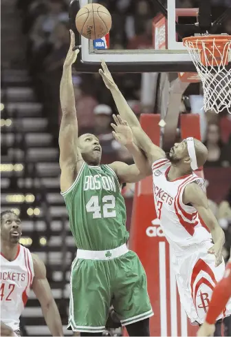  ?? AP PHOTO ?? NET LOSS: Al Horford tries to get a shot off over Corey Brewer during last night’s game. Horford missed a potential game-winner as the Celtics lost, 107-106.