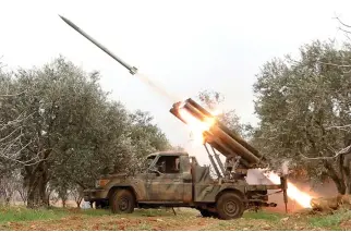  ??  ?? Fighters from the Hayat Tahrir Al-Sham fire missiles from a village near Al-Tabanah during ongoing battles with regime forces in Syria’s Idlib province on Thursday. (AFP)