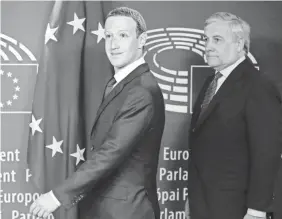  ?? STEPHANIE LECOCQ/EPA-EFE ?? Facebook founder and CEO Mark Zuckerberg, left, is welcomed by European Parliament President Antonio Tajani ahead of Tuesday’s hearing in Brussels.