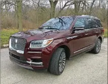  ?? ROBERT DUFFER/CHICAGO TRIBUNE/TNS ?? The massively broad mesh grille dominates rear view mirrors, yet the 2018 Navigator can still fit in most garages, even with roof rails.