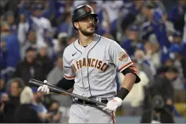  ?? PHOTO BY KEITH BIRMINGHAM — PASADENA STAR-NEWS, FILE ?? The Giants’ Kris Bryant walks back to the dugout after striking out against the Dodgers during the first inning of the National League Division Series at Dodger Stadium on Oct. 11 in Los Angeles.