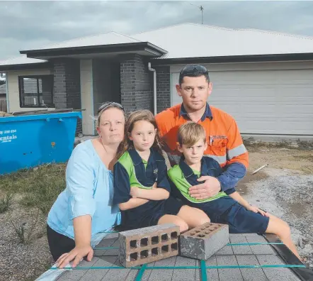  ?? Picture: GLENN HAMPSON ?? Kristi and Martin Sorrell with children Sasha and Marcus at their partially built home in Ormeau Hills.