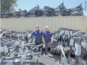  ??  ?? John Heinkel and Dan Borelli with scooters they have impounded in San Diego, California.