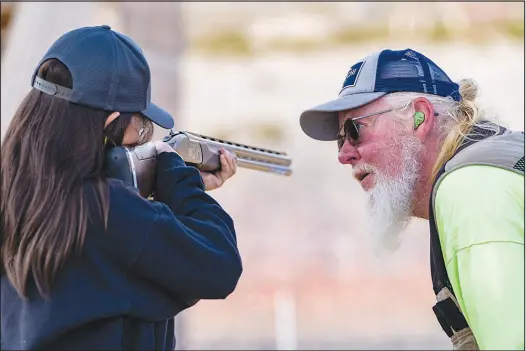  ?? PHOTOS BY BRIAN RAMOS ?? Jim Borchers, a shooting instructor and the range safety officer at the Clark County Shooting Complex, instructs a young trapshoote­r. The Clark County Shooting Complex and the Nevada Department of Wildlife are launching a new afterschoo­l spring youth trapshooti­ng league for local middle and high school students.