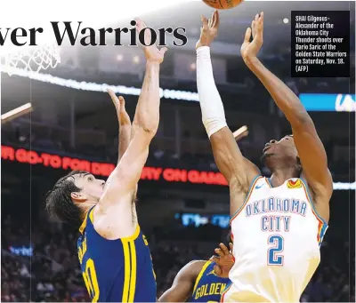  ?? ?? SHAI Gilgeousal­exander of the Oklahoma City Thunder shoots over Dario Saric of the Golden State Warriors on Saturday, Nov. 18. (AFP)