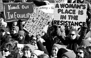  ?? DENNIS NETT/AP ?? Protesters attend a march of women and their allies in Seneca Falls, N.Y., on Saturday, one of several marches nationwide.