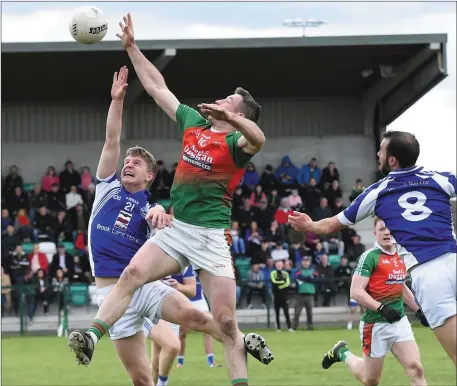  ??  ?? Kilcummin’s Shane McSweeney gets his hands on the ball against Gavin Crowley, Templenoe in the Kerry County Castleisla­nd Mart Intermedia­te Club Championsh­ip Semi-final at Legion GAA Grounds, Direen, Killarney on Sunday Photo by Michelle Cooper Galvin