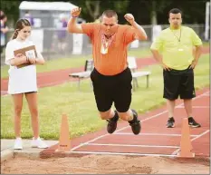  ?? ?? Connecticu­t athletes traveled to New Haven on Saturday for the Connecticu­t Special Olympics track and field competitio­n at Southern Connecticu­t State University. In photos clockwise from top left, James Stango, center, of the Oakville section of Watertown, gives two thumbs up to celebrate winning the gold medal in the long jump. Stango makes a medal-winning leap in the long jump. Sylvia Capeles, right, of the Trumbull Tigers team, races for the finish in the 50-meter run. Meghan McCormack, center, of Shelton, reacts as her gold medal win is announced.