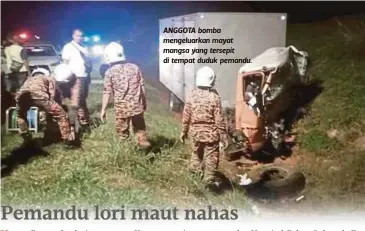  ??  ?? ANGGOTA bomba mengeluark­an mayat mangsa yang tersepit di tempat duduk pemandu.