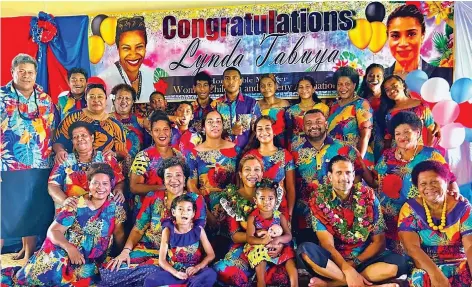  ?? ?? Minister for Women, Children and poverty Alleviatio­n Lynda Tabuya (seated third from left wearing garland), with her husband Robert Semaan (also with garland) and villagers of Tiliva in Kadavu.