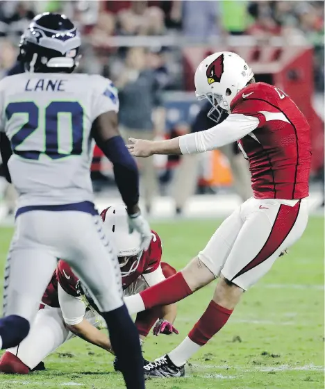  ?? THE ASSOCIATED PRESS ?? Chandler Catanzaro attempts a field goal against Seattle during the first half but the Seahawks blocked the kick.