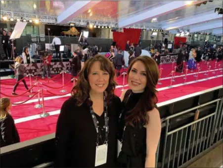  ?? Photo SUBMitteD By Dee SMith ?? Dee Smith and her daughter Brittany were lucky enough to have the fan experience at this year’s Academy Awards. here they stand in the bleachers near the famous red carpet.