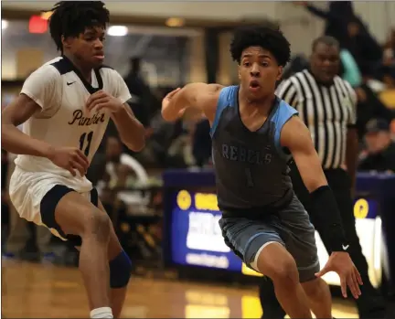  ?? TIM PHILLIS — FOR THE NEWS-HERALD ?? South’s Will Hagwood drives as Euclid’s Steven Key defends Jan. 21at Euclid.