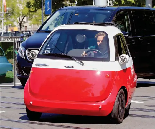  ??  ?? Got some front: The modern Microlino has a 20 horsepower electric motor and keeps the original front-opening door