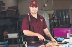  ?? Picture: STEWART McLEAN ?? SERIOUS PROBLEM: Apprentice butcher Jason Chapman at Byrnes Meats, which is facing a dire staff shortage.