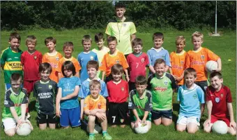  ??  ?? Paul McMahon (coach) with the under 9s at the Kelloggs GAA Cúl Summer Camp at Farranfore GAA grounds on Monday