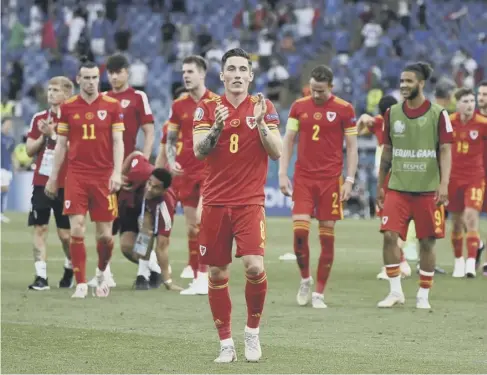  ??  ?? 0 Harry Wilson applauds the Welsh fans at the end of the 1-0 defeat by Italy in Rome yesterday