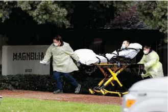  ?? Associated Press ?? ■ A patient is evacuated Wednesday from the Magnolia Rehabilita­tion and Nursing Center in Riverside, Calif. More than 80 patients from the Riverside skilled nursing facility were evacuated to other healthcare locations throughout Riverside County.