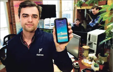  ?? Erik Trautmann / Hearst Connecticu­t Media ?? Sacred Heart University graduates, including Matthew Fatse, Wilder Rumpf and Adam Pulcyn, launch a comprehens­ive finance app Fintron. Fintron claims to be the youngest broker dealer in the country.