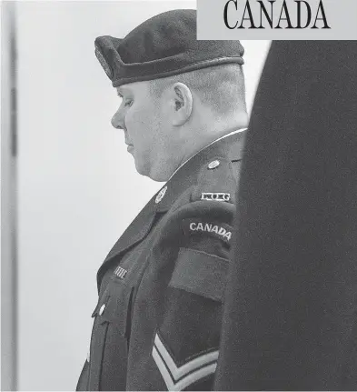  ?? ANDREW VAUGHAN / THE CANADIAN PRESS ?? Cpl. Garett Rollman arrives at a military court in Kentville, N.S., on July 31. Rollman, who was accused of using an inappropri­ate term for a black co-worker’s hair and of later striking a supervisor, has been found not guilty.