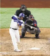  ?? Ron Jenkins / Getty Images ?? Max Muncy swings a big bat for Los Angeles, which lost the World Series in 2017 and 2018.