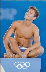  ?? FABRICE COFFRINI / AGENCE FRANCE-PRESSE ?? Britain’s Tom Daley strikes a pose during a training session at the Aquatics Center on the eve of the official opening of the 2012 London Olympic Games.