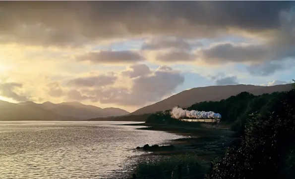  ?? Andrew Southwell ?? The truncated 2021 season of ‘Jacobite’ trains has come to a close, with autumn trains offering different perspectiv­es, especially as LMS Stanier ‘5MT’ 4-6-0 44871 was unusually turned to face south for the last few weeks. With the sun setting on Dail Liath, it skirts the shores of Loch Eil with the 16.55 Mallaig-fort William on September 29.