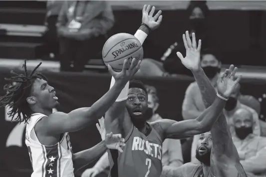  ?? Tim Nwachukwu / Getty Images ?? The Rockets’ David Nwaba challenges a shot by the 76ers’ Tyrese Maxey during a fourth-quarter rally that made things more interestin­g at the end.