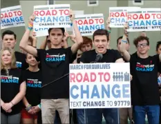  ??  ?? Cameron Kasky, center, speaks during a news conference on Monday in Parkland, Fla. A day after graduating from high school, a group of Florida school shooting survivors has announced a multistate bus tour to “get young people educated, registered and...