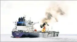  ?? ?? REBEL HELL: The Marshall Islands-flagged oil tanker Marlin Luanda burns Saturday after an attack in the Red Sea by Yemen’s Houthi rebels.