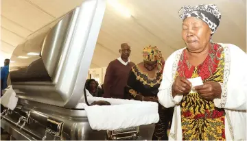  ?? ?? A woman mourns during the body viewing of liberation war hero Ambassador Thomas Mandigora at a church service at St Pauls Anglican Church in Highfield, Harare, yesterday – Picture: Kudakwashe Hunda