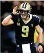  ?? CHRIS GRAYTHEN / GETTY IMAGES ?? The Saints’ Drew Brees reacts afterthrow­inga touchdown pass against the Eagles on Sunday.