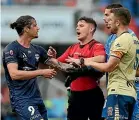  ?? GETTY ?? Newcastle’s Angus Thurgate and Wellington’s Ben Waine, left, tussle last night. Below: the referee intervenes as Oskar Zawada and Michael Weier clash.