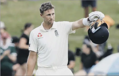  ?? PICTURE: AP/MARK BAKER ?? LEADING BY EXAMPLE: England captain Joe Root celebrates scoring a double century against New Zealand at Seddon Park in December.