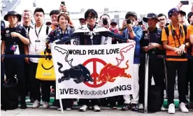  ?? ?? Red Bull fans in the pit lane at Suzuka. The Austrian team’s superiorit­y has been near total this year. Photograph: Clive Rose/Getty Images