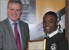  ??  ?? Elliot Kwelele receives his award from Cllr. Mark Dearey, Chairman Muncipal District of Dundalk at the inaugural Civic Awards Presentati­on Ceremony held in the County Museum