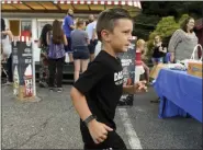  ?? BEN HASTY - MEDIANEWS GROUP ?? Dakota Renney, 7, during a fundraiser at the Rita’s Italian Ice & Frozen Custard on Perkiomen Avenue in St. Lawrence on July 26. He was diagnosed with a brain tumor and had surgery to remove it July 31 at Children’s Hospital of Philadelph­ia.