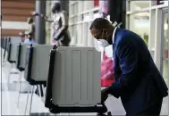  ?? MATT SLOCUM — THE ASSOCIATED PRESS ?? Philadelph­ia City Council President Darrell L. Clarke fills out his ballot at the opening of a satellite election office at Temple University on Sept. 29in Philadelph­ia.