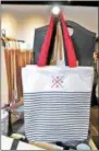  ??  ?? Toga Heritage totes can be purchased at new store Toga Heritage in downtown Saratoga Springs.