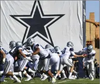  ?? MICHAEL OWEN BAKER - THE ASSOCIATED PRESS ?? In this Monday, July 29, 2019, file photo, Dallas Cowboys practice at the NFL football team’s training camp in Oxnard, Calif.