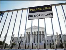  ?? Getty Images ?? A view of the U.S. Supreme Court through security fencing on June 1 in Washington, D.C.