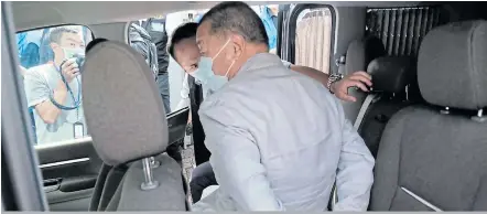  ?? Picture: BLOOMBERG / PAUL YEUNG ?? TIED UP: Jimmy Lai, chair of Next Digital Ltd, sits handcuffed as he is led away from his residence by law enforcemen­t officials in Hong Kong on Monday.