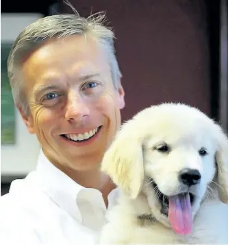  ?? POSTMEDIA FILES ?? Dr. David Haworth, a vet, says a pet dog like his golden retriever Bridger, can protect children from immune-related diseases like allergies, asthma and eczema.