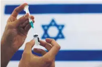  ?? TSAFRIR ABAYOV THE ASSOCIATED PRESS FILE PHOTO ?? Israel took the lead in its vaccine rollout by securing millions of Pfizer doses and exploiting its centralize­d health-care system.