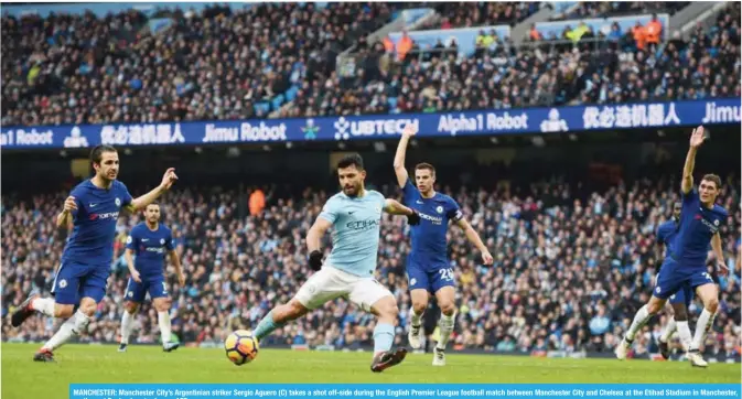  ?? — AFP ?? MANCHESTER: Manchester City’s Argentinia­n striker Sergio Aguero (C) takes a shot off-side during the English Premier League football match between Manchester City and Chelsea at the Etihad Stadium in Manchester, north west England yesterday.