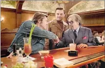  ?? Andrew Cooper Columbia Pictures ?? BRAD PITT, left, Leonardo DiCaprio and Al Pacino at L.A.’s Musso & Frank Grill in “Once Upon a Time ... in Hollywood.”