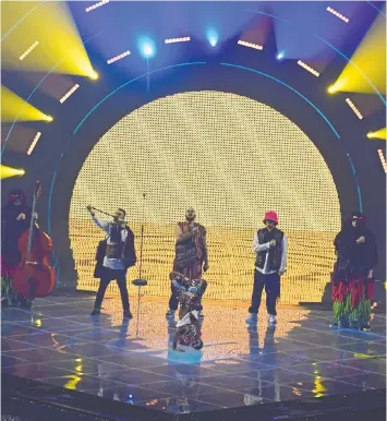  ?? GIORGIO PEROTTINO/GETTY IMAGES ?? Ukraine's Kalush Orchestra performs during Saturday's Grand Final show of the 66th Eurovision Song Contest in Turin. As expected, the band won the competitio­n with its blend of rap and traditiona­l folk music.