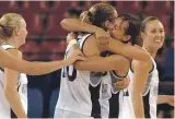  ?? DAVID UNWIN/STUFF PETER MEECHAM / STUFF, GETTY IMAGES ?? Far left: Megan Compain, former WNBA basetballe­r and Tall Ferns Olympian who is now on the All Blacks management team.
Above and left: Megan Compain celebrates team-mates after making the gamewinnin­g shot against China at the Athens Olympics in 2004.
Below: Megan Compain had a 10-year career with the Tall Ferns that took in two Olympic appearance­s.