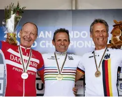  ??  ?? Right World Champs accept their jerseys on the podium